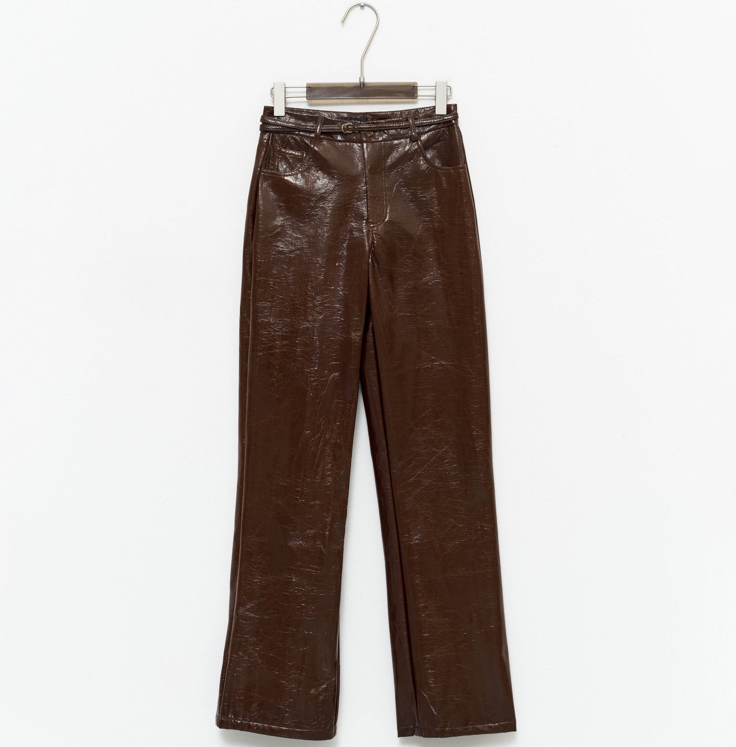 tight-fitting brown faux leather trousers