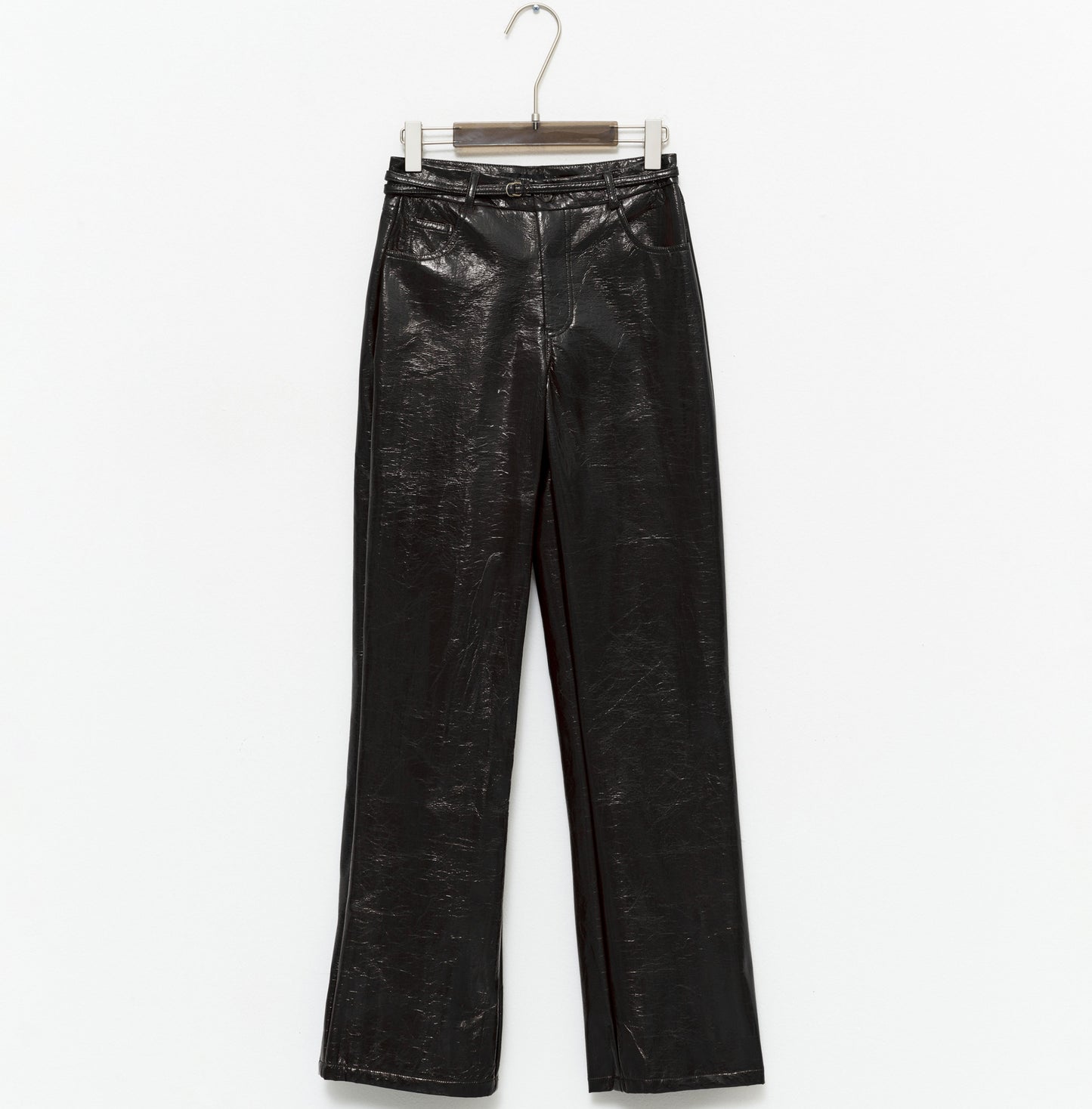 tight-fitting black faux leather trousers