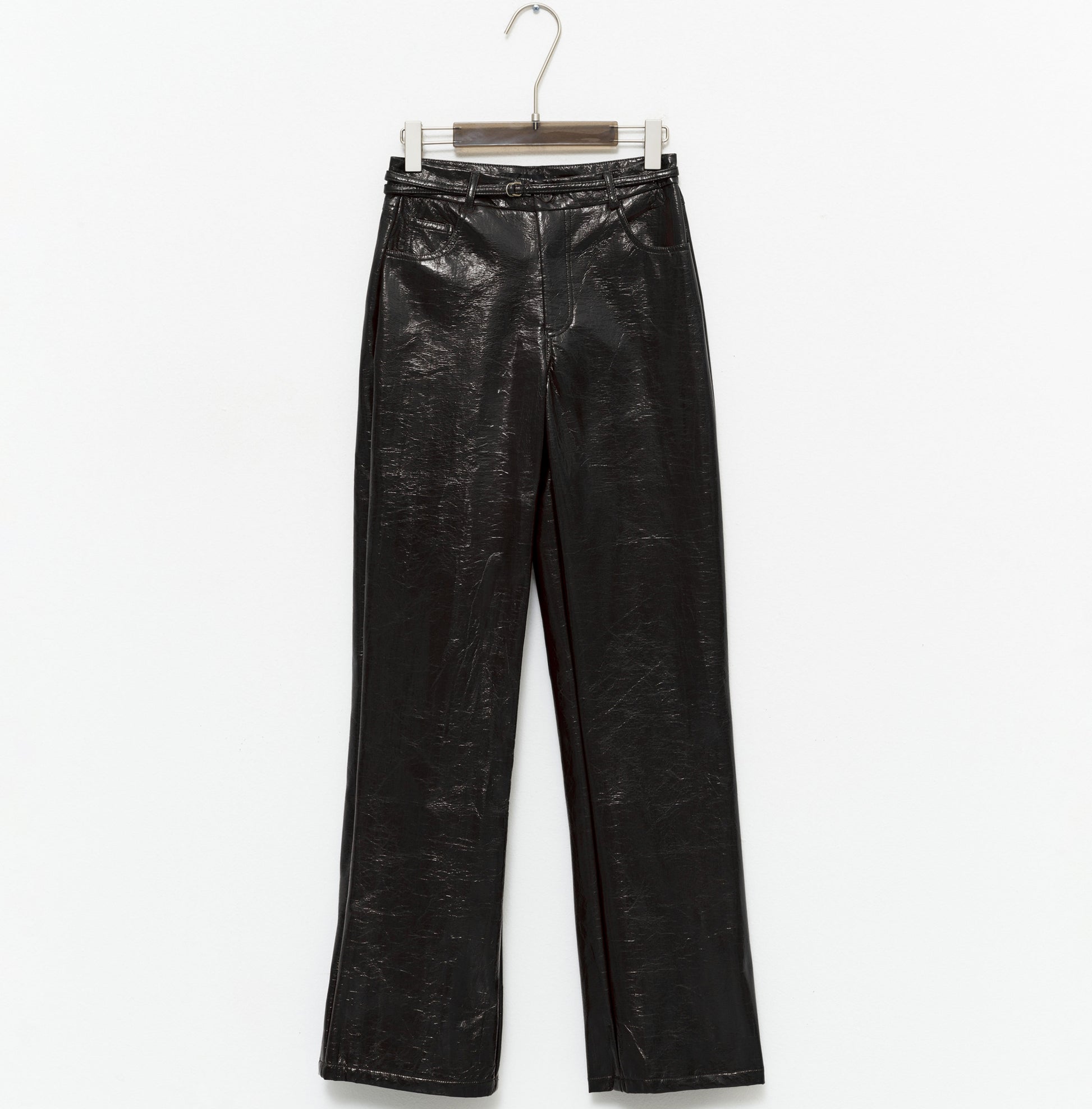 tight-fitting black faux leather trousers